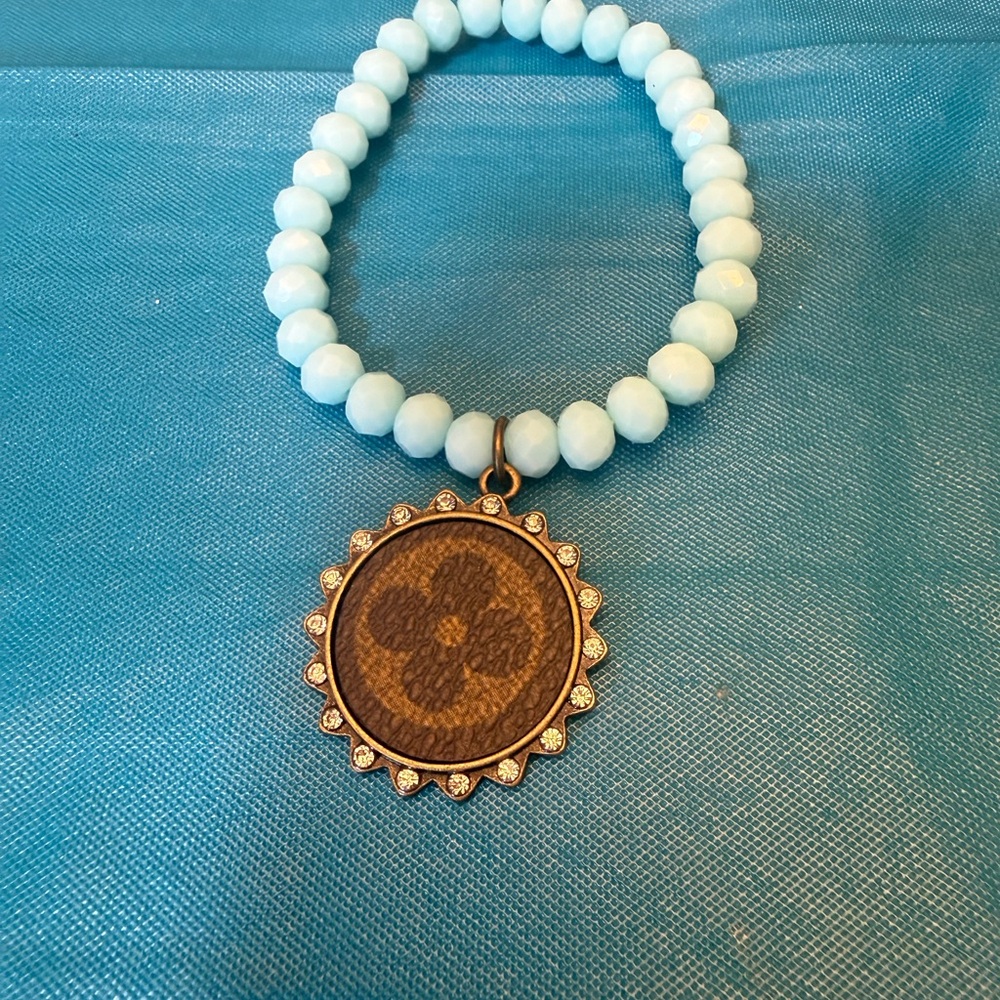 Beaded Turquoise Bracelet with Brown Monogram LV Pendant - Picture 2 of 2